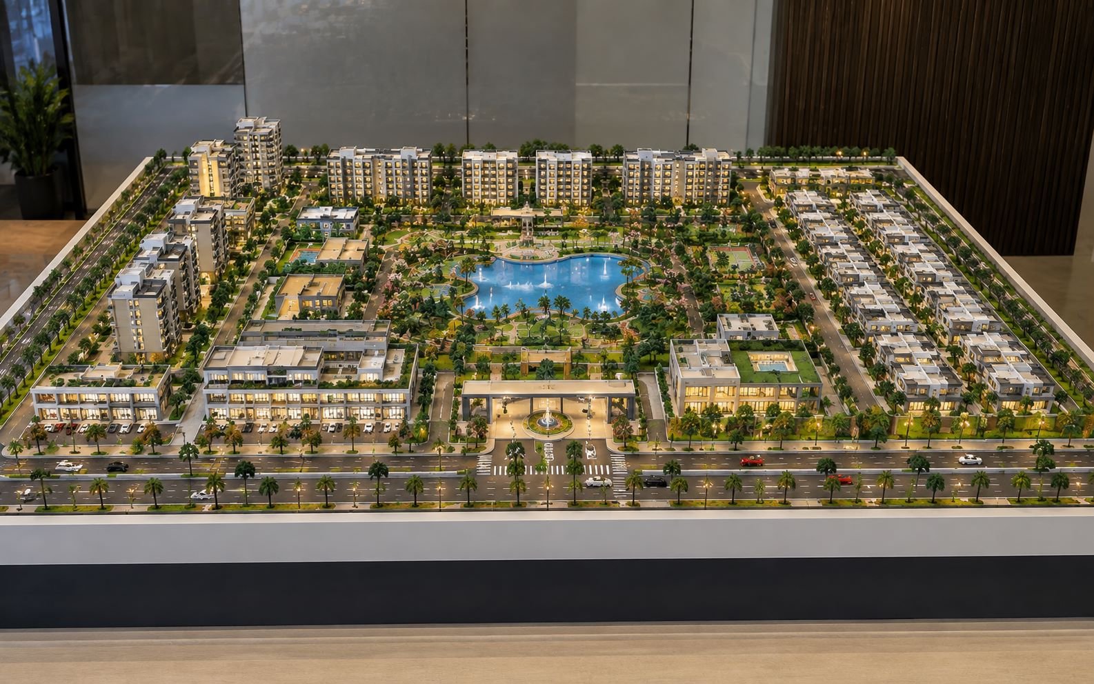 Real estate architectural scale model featuring residential buildings, villas, landscaping, roads and amenities