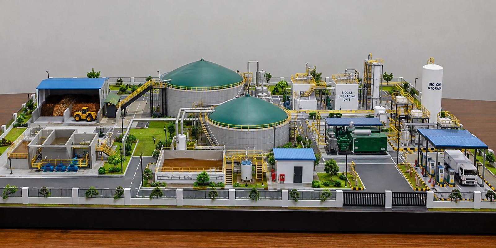 Detailed biogas plant scale model with digesters, gas piping, purification unit, Bio-CNG storage and power generation