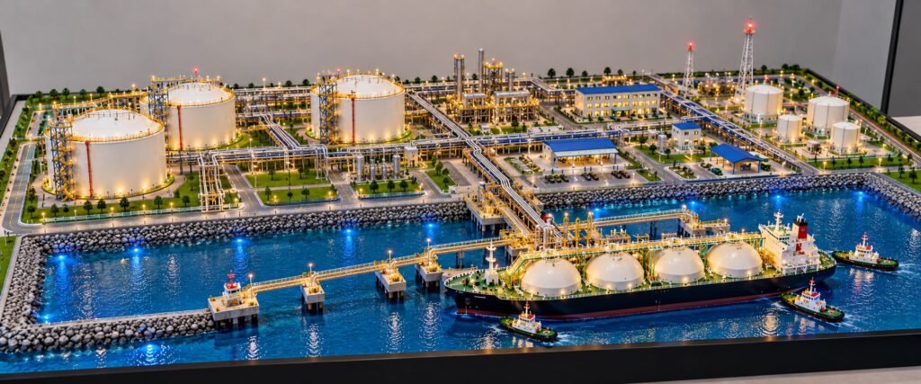 Detailed LNG Terminal Scale Model with Storage Tanks, LNG Carrier Ship and Industrial Piping